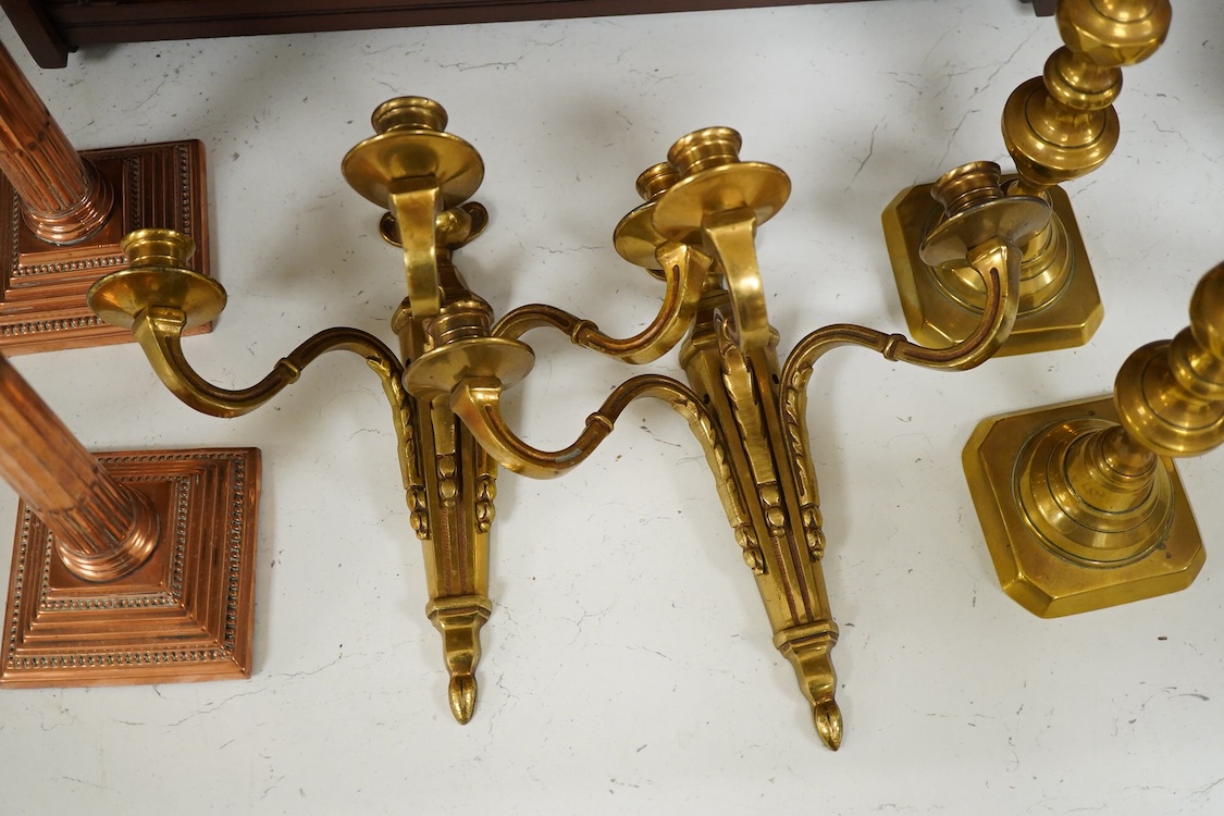 A pair of Corinthian column copper candlesticks, a pair of three branch sconces and pair of brass candlesticks, together with brass-mounted mahogany wall shelf /cabinet - 33cm high